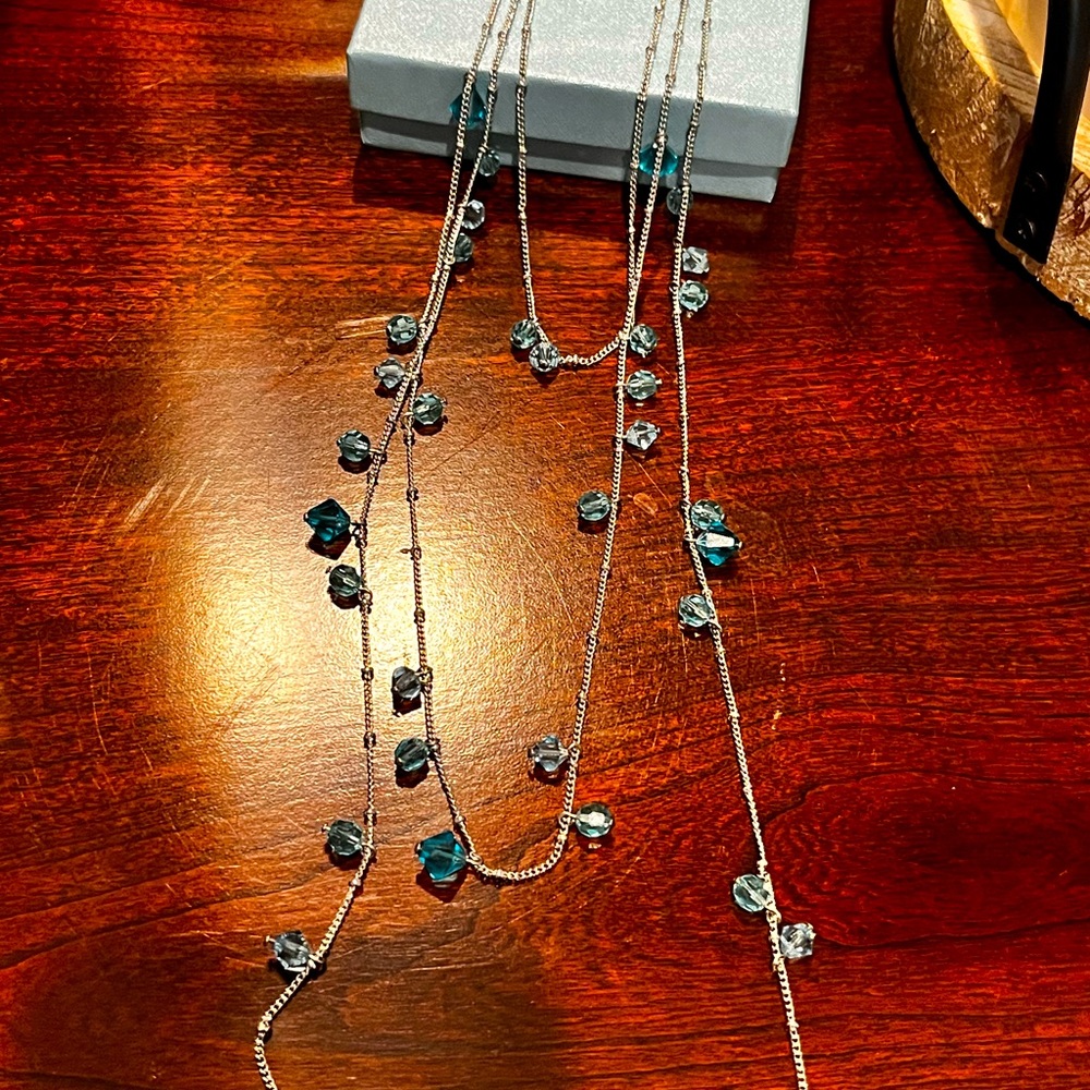 Three tiered silver and aqua blue touchstone Crystal necklace.  Never worn